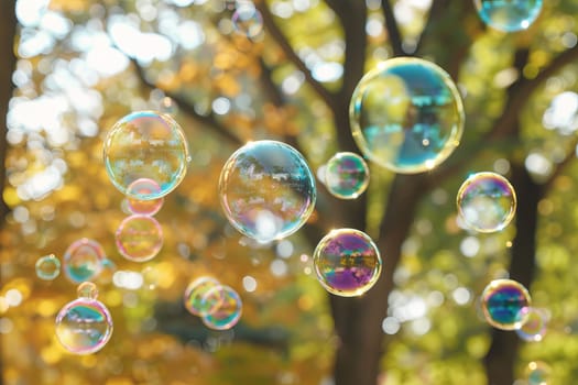 Rainbow-colored soap bubbles floating transparently in the air on a sunny day