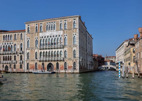 Venice, Italy - September 6, 2022: Ca' Foscari palace and the Giustinian palace  at Grand canal in the Dorsoduro district of Venice, Italy.