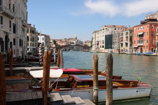 Venice, Italy - September 5, 2022: Wooden mooring pole at Canal Grande in Venice. Italy