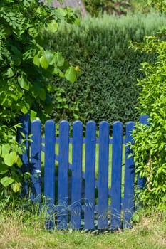 Blue wooden garden gate, Germany