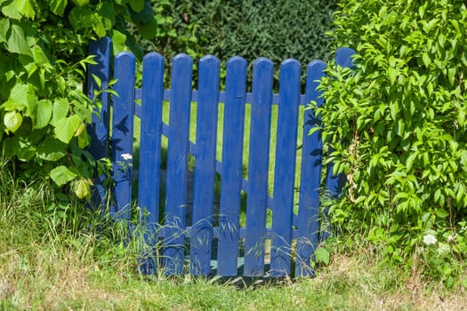 Blue wooden garden gate, Germany