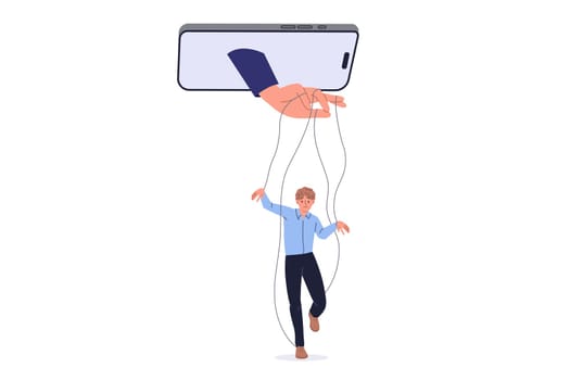 Manipulation of person using social networks and applications in mobile phone, with hand controlling man like puppet. Problems of digital manipulation and disinformation or propaganda on internet