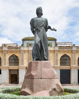 The Nasimi monument in Baku, Azerbaijan. The statue depicts the famous Azerbaijani poet, standing tall on a granite pedestal