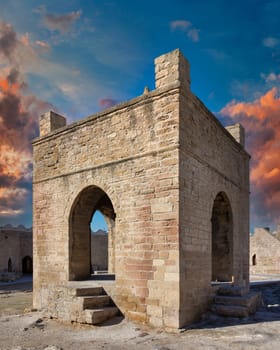 A view of the courtyard of the Ateshgah Fire Temple in Baku, Azerbaijan. The temple is lit by the setting sun