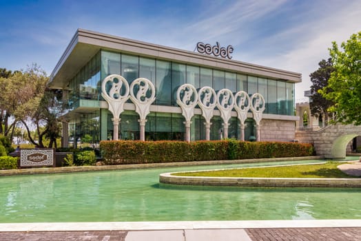 Sedef, or Sadaf, a modern restaurant building with a glass facade sits on an artificial island in the Little Venice canal system along Bakus Seaside Boulevard, Azerbaijan