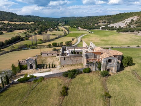 Aerial view Monsalud Cistercian Monastery, in Corcoles, was one of the most important medieval buildings in the territory of Guadalajara for centuries, Side view