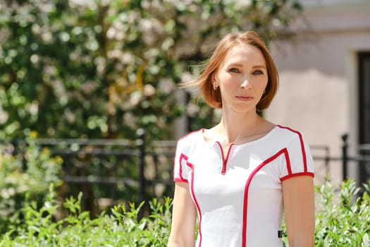 Medium closeup portrait of fitness sport redhead woman