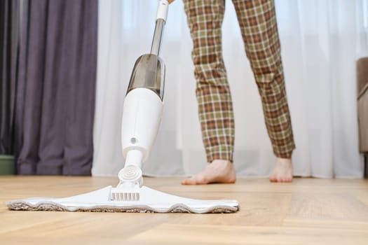 Closeup view of mopping floors with modern swab