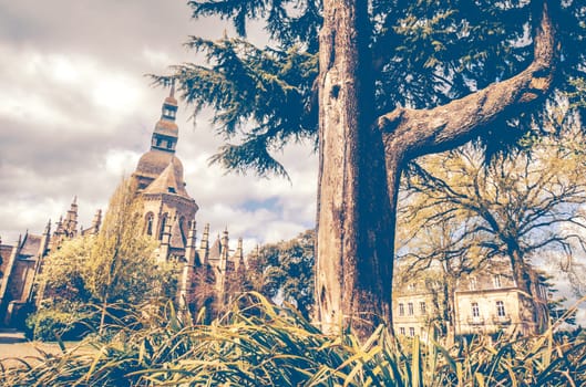 St Sauveur church viewd from the garden in medieval old town of Dinan, Brittany, France