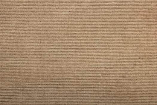 beige corduroy fabric background. slightly worn