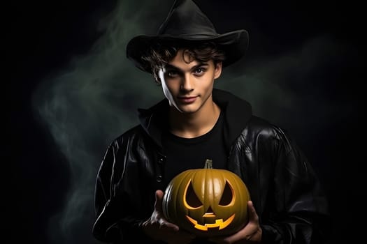 Young adult Caucasian man in a witch costume holding a carved pumpkin, perfect for Halloween-themed media and promotions.