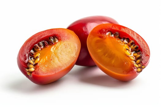 Tangy tamarillo with smooth, glossy skin and rich, reddish-orange color