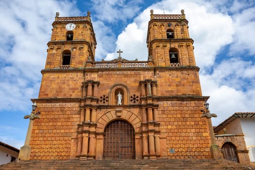 Parish Church of the Immaculate Conception in Barichara, Santander department Colombia. The church's towering bell tower and beautiful windows make it a true masterpiece of colonial architecture.