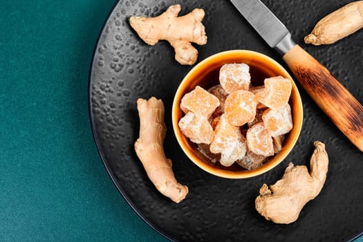 Sweet and spicy candied ginger, candied ginger dessert. Top view. Copy space.