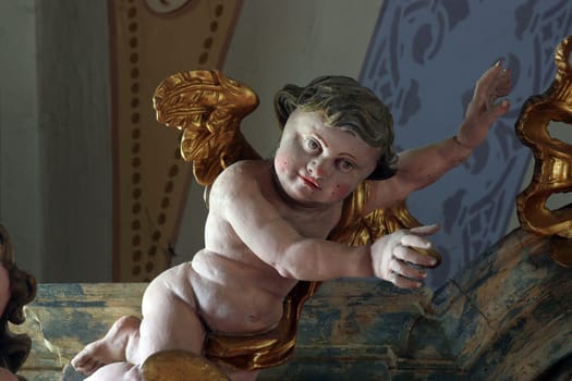 Angel statue on altar in the church of Holy Trinity in Klenovnik, Croatia