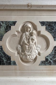 Virgin Mary with baby Jesus, relief on the altar in the Church Our Lady of Mount Carmel in Orebic, Croatia