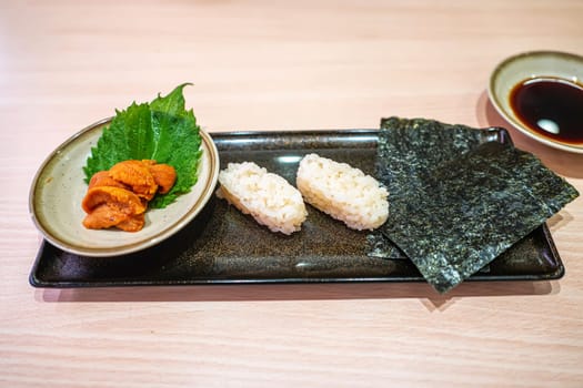 Uni sushi in the plate. Sushi is a type of food preparation originating in Japan.