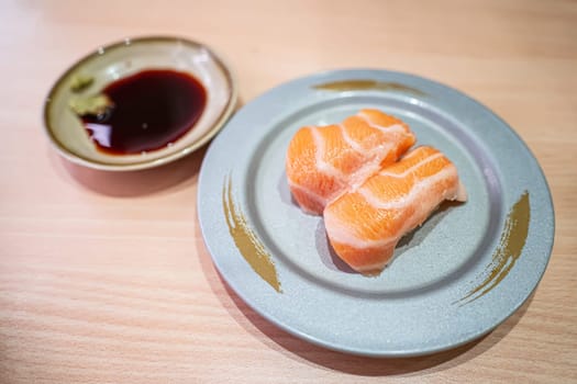 Salmon belly sushi in the plate. Sushi is a type of food preparation originating in Japan.