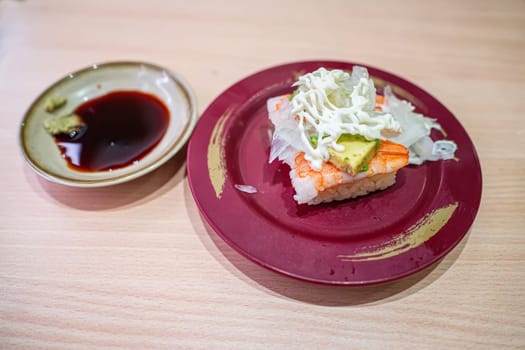 Avocado shrimp sushi in the plate. Sushi is a type of food preparation originating in Japan.