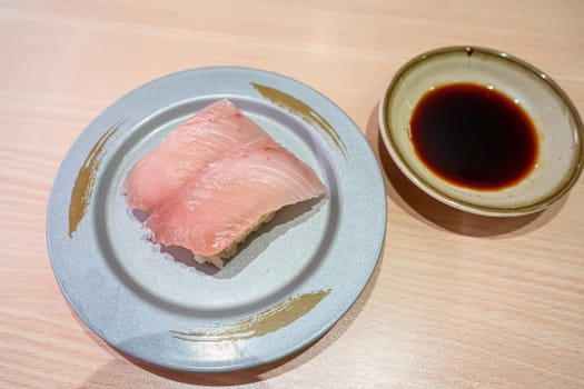 Toro flying fish belly sushi in the plate. Sushi is a type of food preparation originating in Japan.