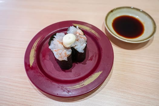 Fresh shrimp sushi in the plate. Sushi is a type of food preparation originating in Japan.