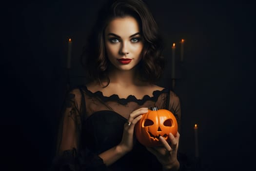 A mysterious woman in a dark dress is holding a carved Halloween pumpkin with candles glowing in the background