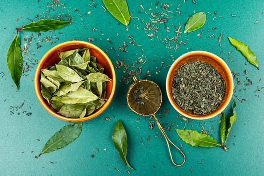 Healthy bay leaf tea and vintage tea sieve. Slimming tea. Top view.
