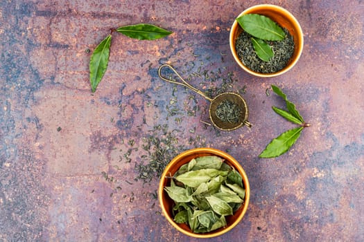 Fresh bay leaf tea and vintage tea sieve. Medicinal herbs. Slimming tea.