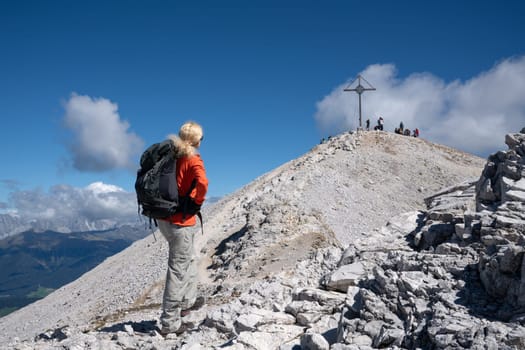Prags, Italy - August 21, 2022: Sportiv woman trecking to the peak, Dolomites in South Tirol on August 21, 2022 in Italy, Europe