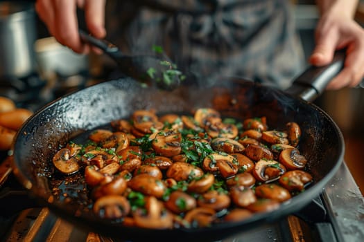 Closeup of hands cooking sautéed mushrooms with herbs in a pan, steam rising, and warm kitchen lighting