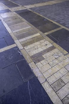 Cobblestone floor with typical shapes of the city of Lisbon