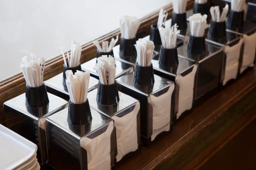 Napkin holders with toothpick dispenser on top. Table service concept