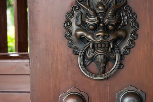 Lion head door handle in Chinese temple