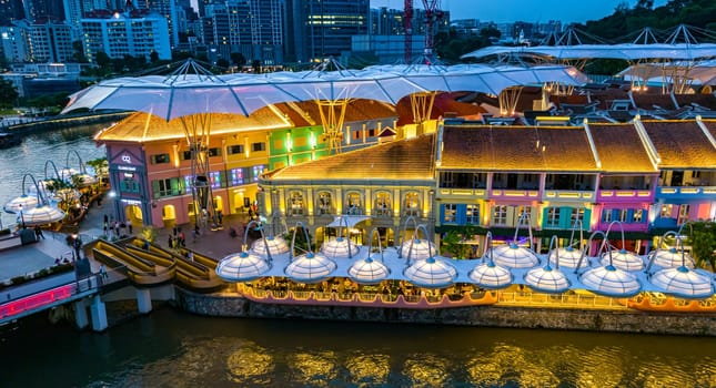 SINGAPORE - MAY 12, 2024: Clarke Quay after sunset, popular nightlife district of Singapore