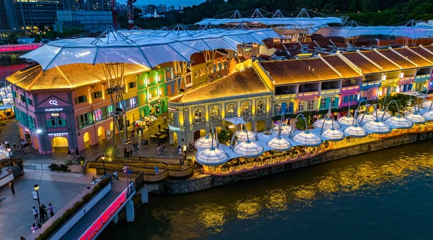 SINGAPORE - MAY 12, 2024: Clarke Quay after sunset, popular nightlife district of Singapore