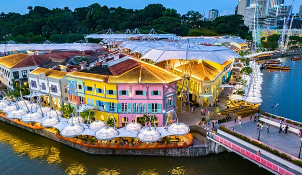 SINGAPORE - MAY 12, 2024: Clarke Quay after sunset, popular nightlife district of Singapore