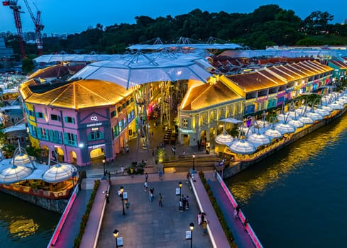 SINGAPORE - MAY 12, 2024: Clarke Quay after sunset, popular nightlife district of Singapore