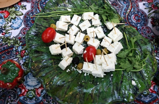 appetizers of white cheese and cherry tomatoes