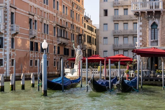 Venice, Italy - September 6, 2022: Moored gondolas on the Grand Canal in Venice, Italy