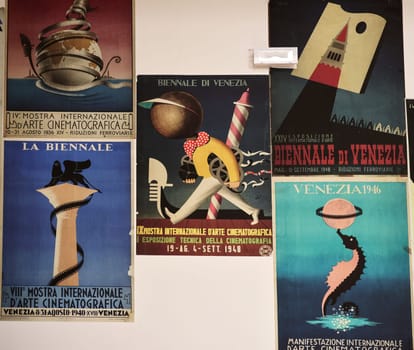 Venice, Italy - May 7, 2024:  60th Venice Art Biennale in Venice. Old posters advertising the Venice Biennale presented in the central pavilion in Giardini