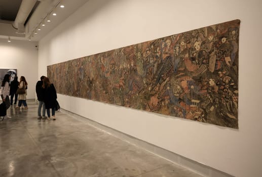 Venice, Italy - May 7 2024: Foreigners Everywhere 60th Venice Art Biennale in Venice. Crucifixion of fhe Soul by Magde Gill. Coloured inks on calico.