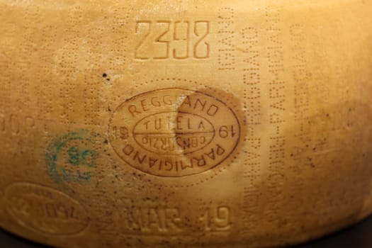 Cracow, Poland - November 5, 2021: Whole wheel of Parmigiano Reggiano cheese at Enoexpo and Gastrofood - Trade Fair for Food and Drinks for Catering