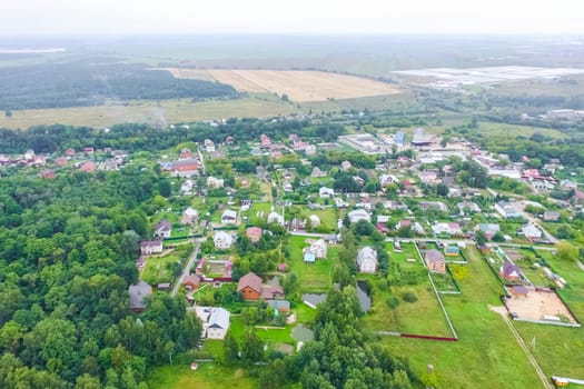 Top view of the village, fields and forests near the village