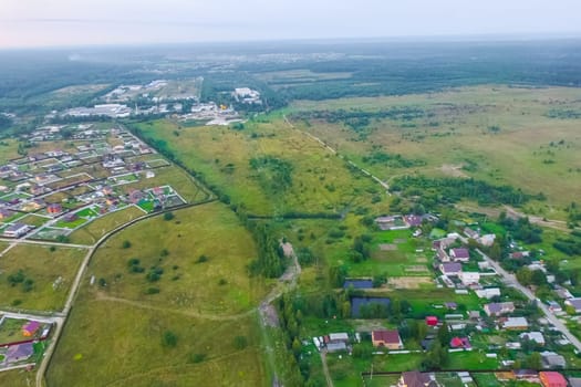 Top view of the village, fields and forests near the village