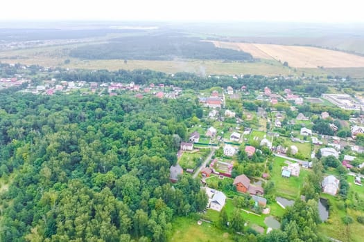 Top view of the village, fields and forests near the village