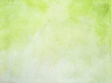 Concrete lime green colorful wall surface texture. Abstract grunge bright illuminating color background. Copyspace.