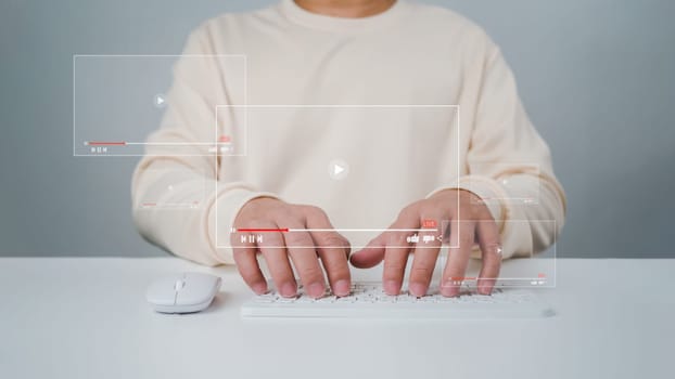 A man using mouse and keyboard for streaming online, watching video on internet, live concert, show or tutorial, live streaming video on internet, digital multimedia player concept.