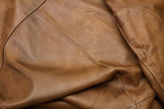 Detail of light brown leather clothing with a distinctive color and texture