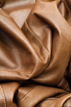 Detail of light brown leather clothing with a distinctive color and texture