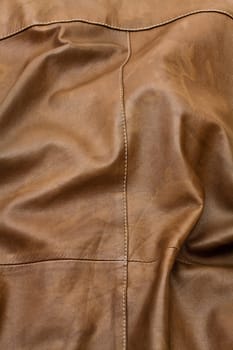 Detail of light brown leather clothing with a distinctive color and texture